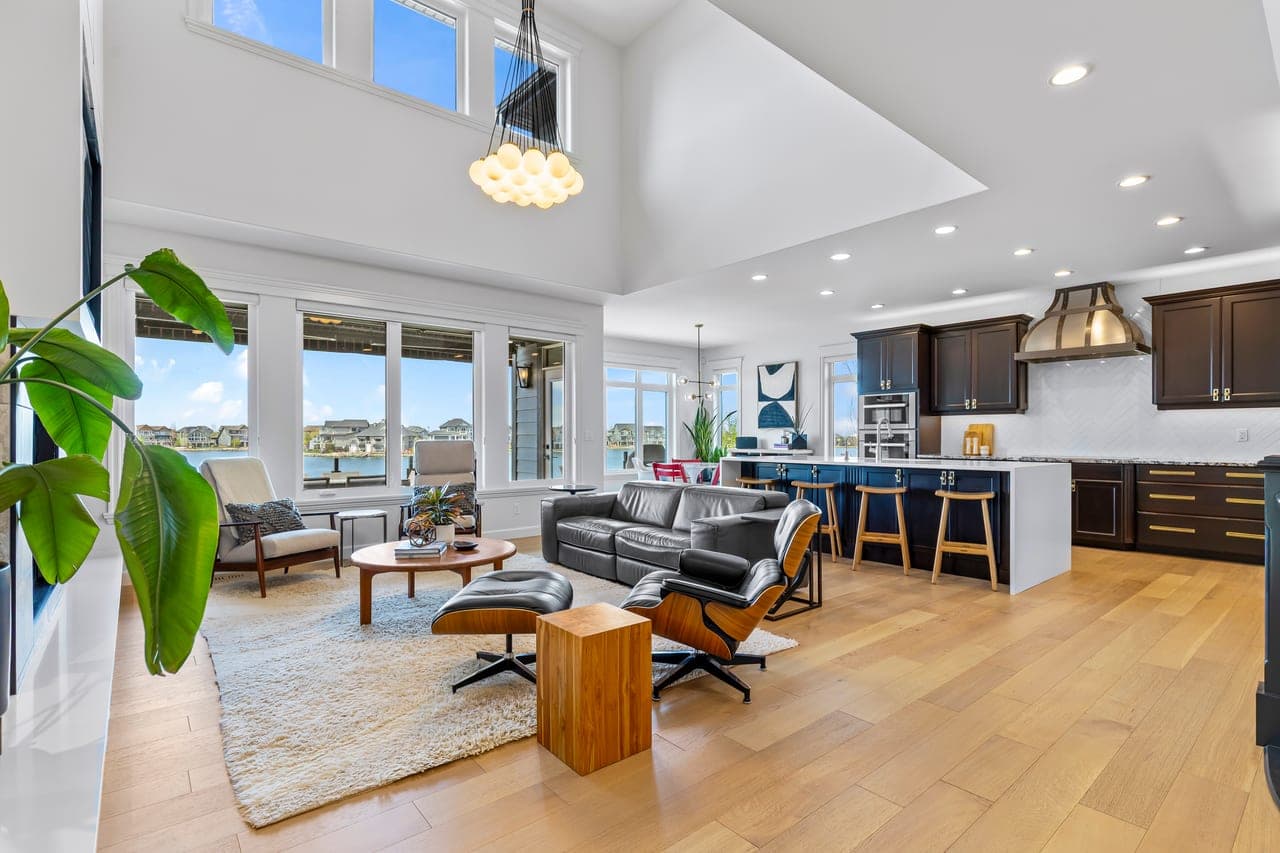 Bright spacious Auburn Bay living room with lake view prepared for Calgary real estate photography