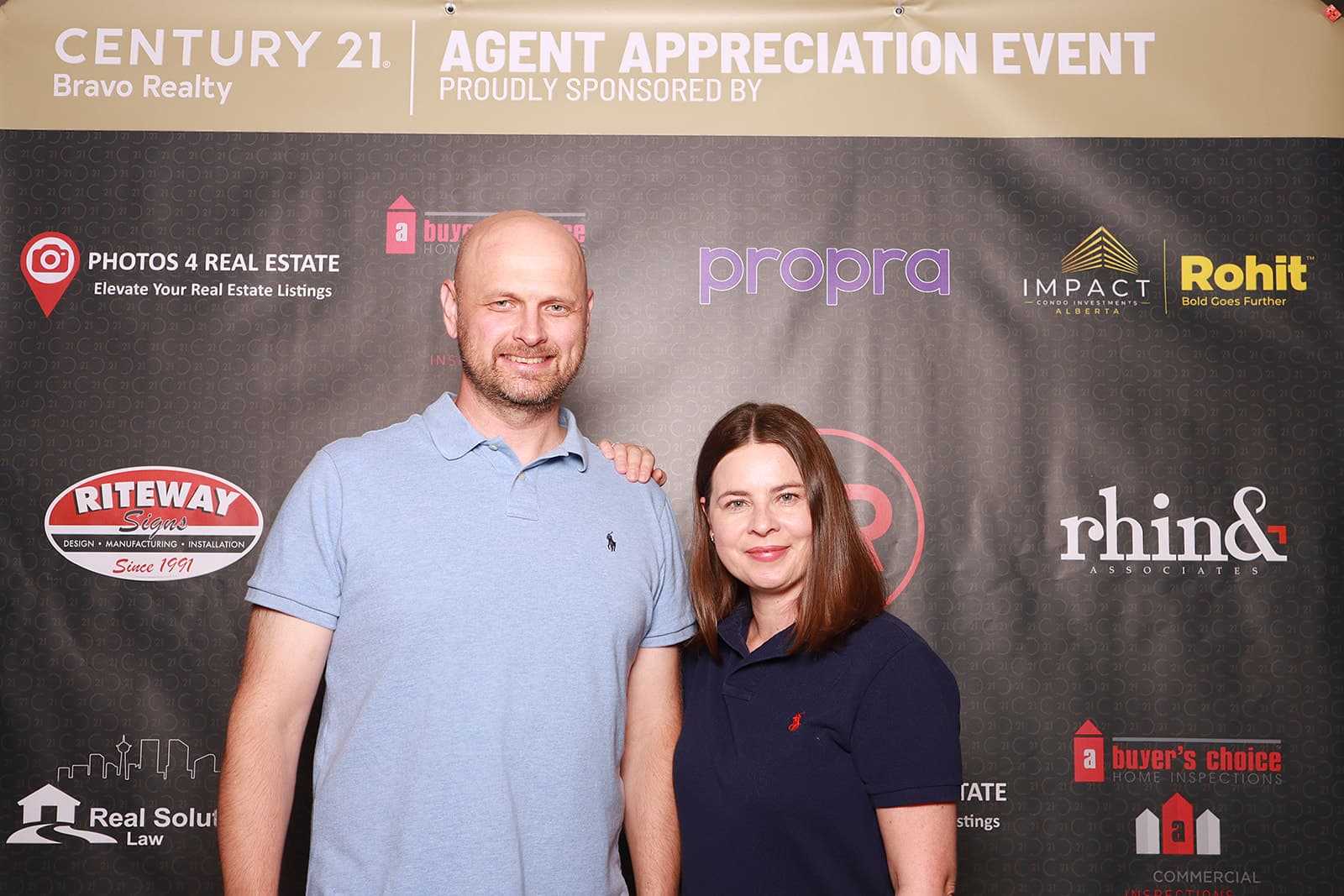 Vlad and Iryna at the C21 Bravo Realty golf event photobooth