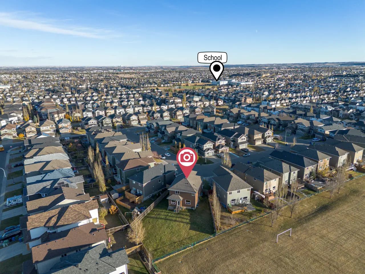 Aerial photo of a house on a corner lot in Calgary