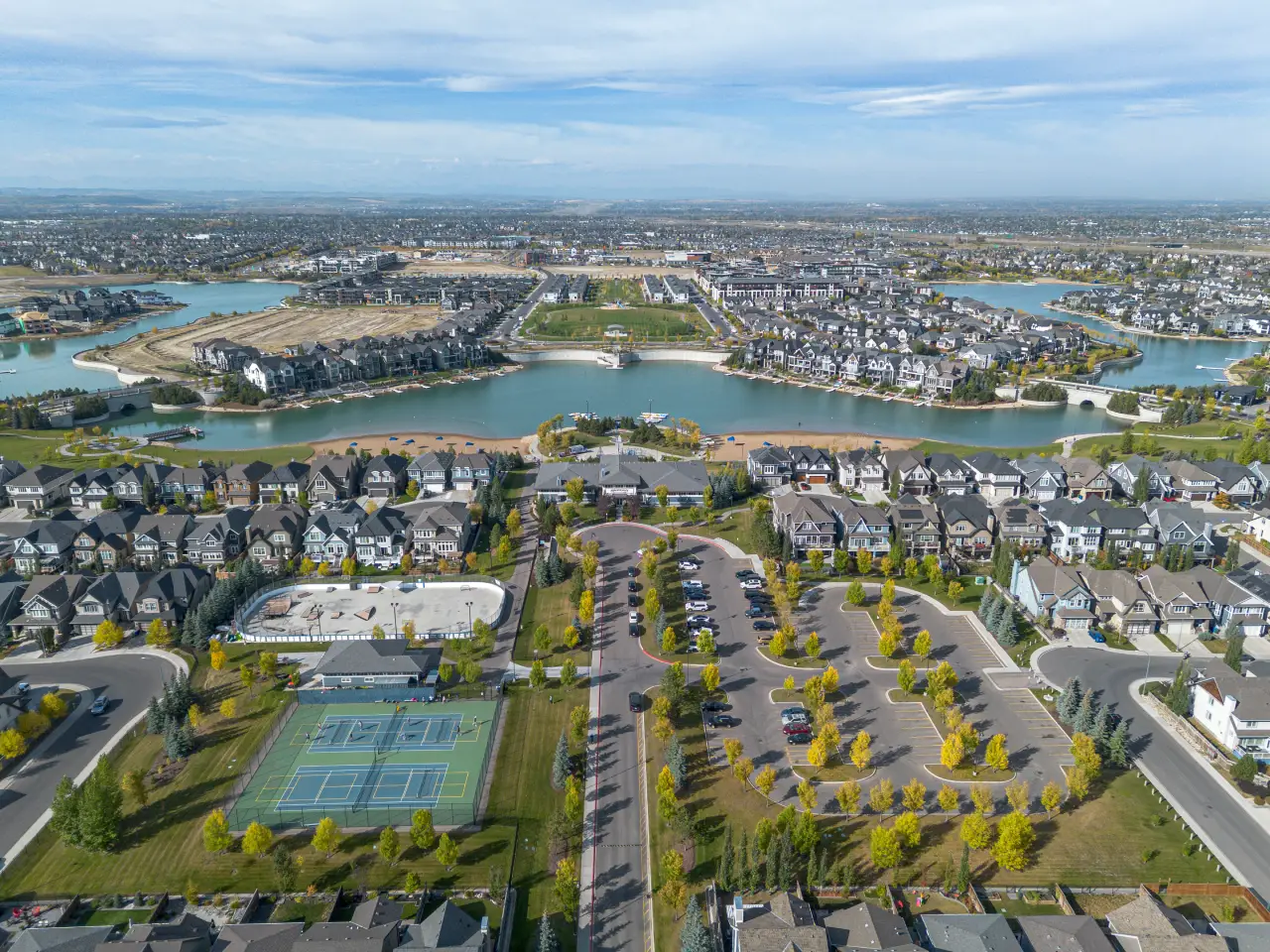 Drone photo showing Mahogany Lake and nearby homes in Calgary