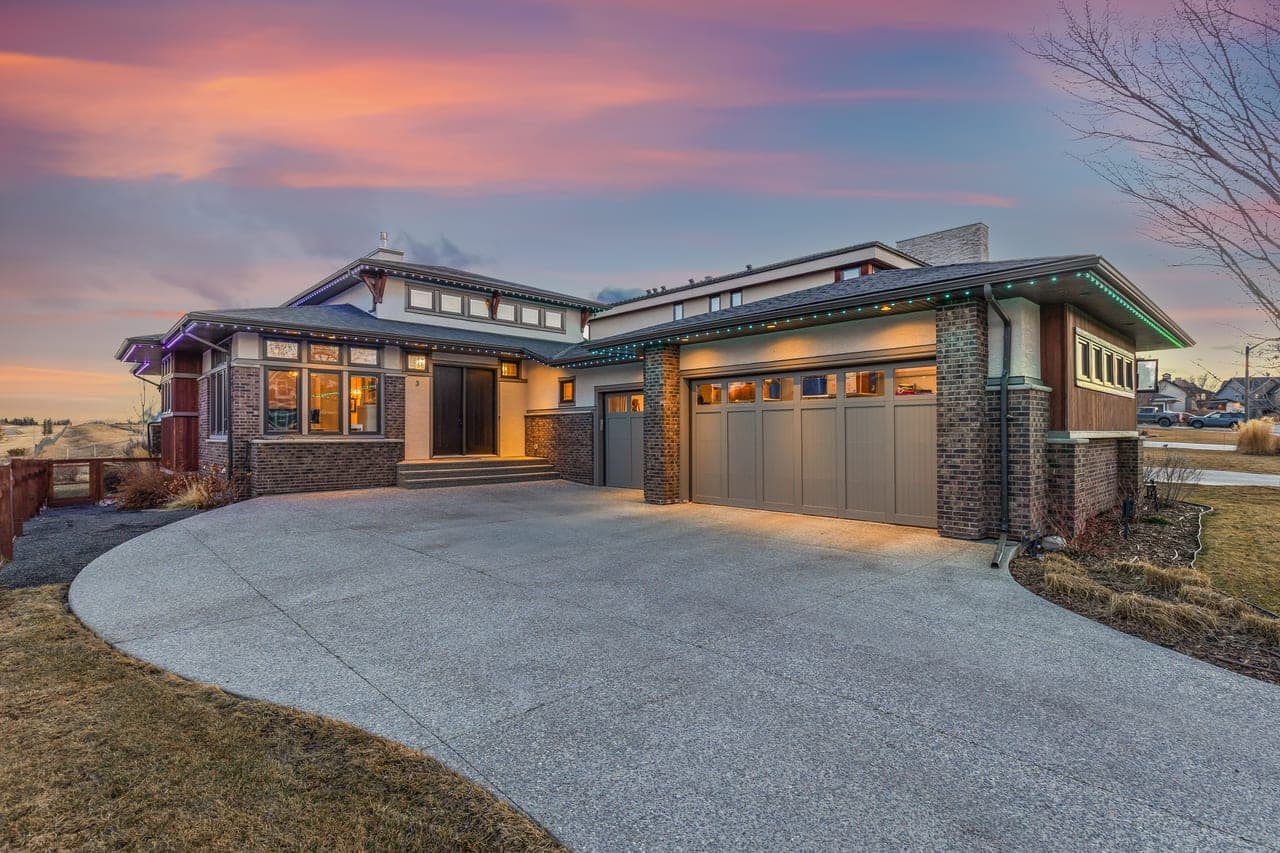 Calgary home photographed at twilight with warm interior lights by Photos 4 Real Estate