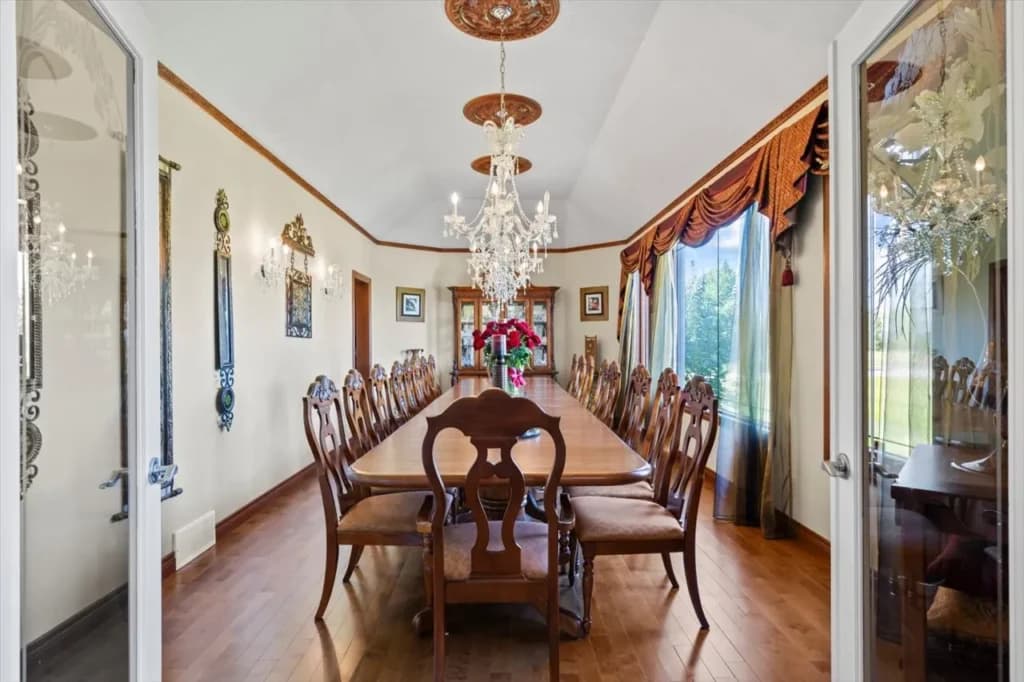 Luxury dining room real estate photo in a Bearspaw estate home prepared for an MLS listing