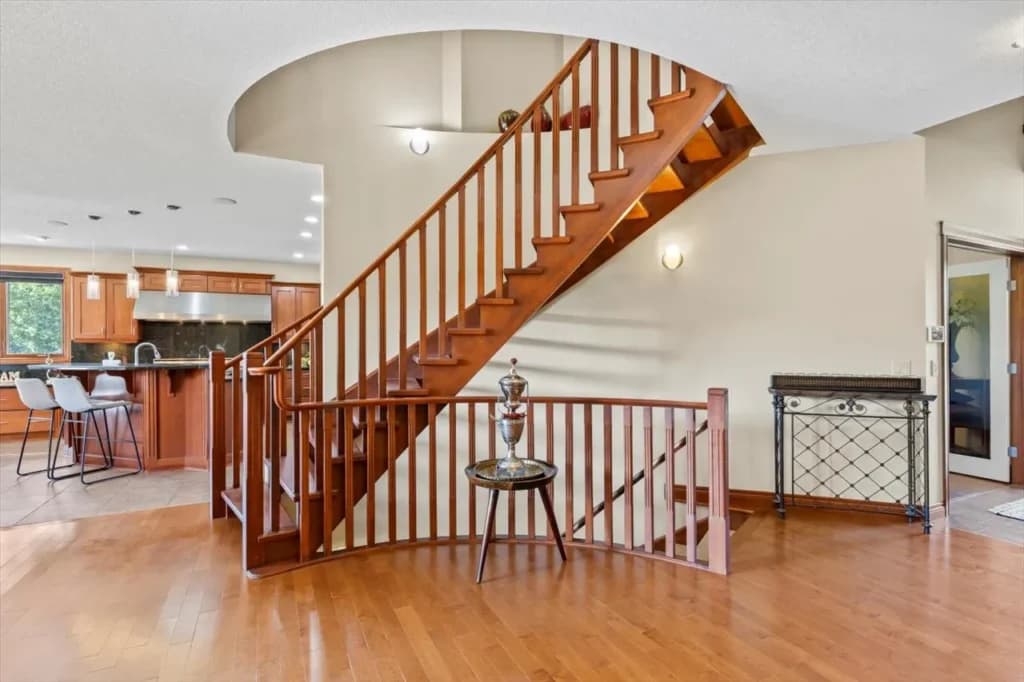 Luxury staircase detail photo in a Bearspaw estate home for high-end real estate marketing