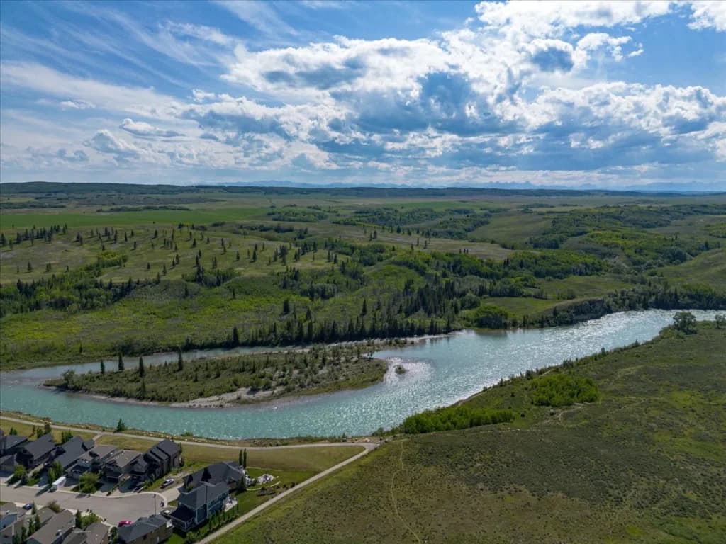 Drone view of a Cochrane property and surrounding hillside neighbourhood for real estate marketing
