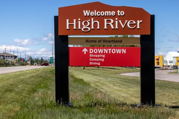 Exterior real estate photo of a High River home with small-town character by Photos 4 Real Estate