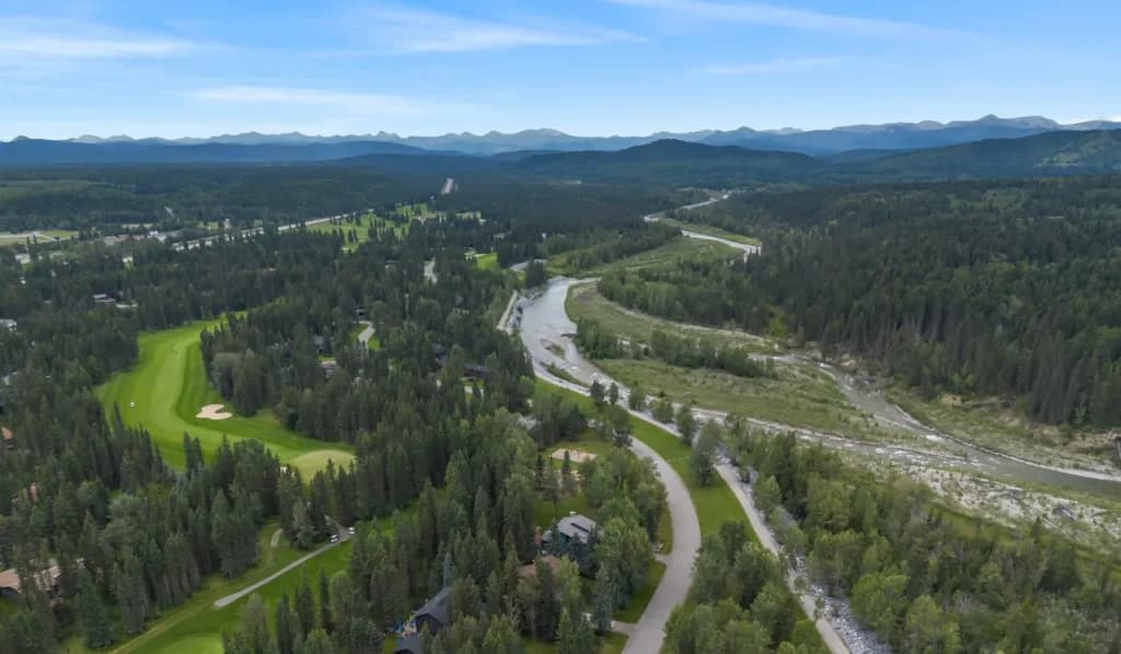 Drone view of a Bragg Creek area property in Rocky View County showing land and surrounding landscape