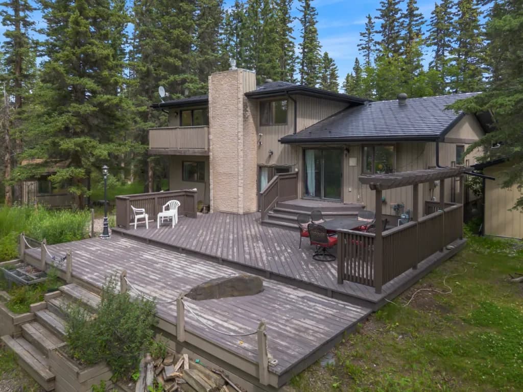 Exterior real estate photo of a home near Bragg Creek in Rocky View County prepared for listing marketing