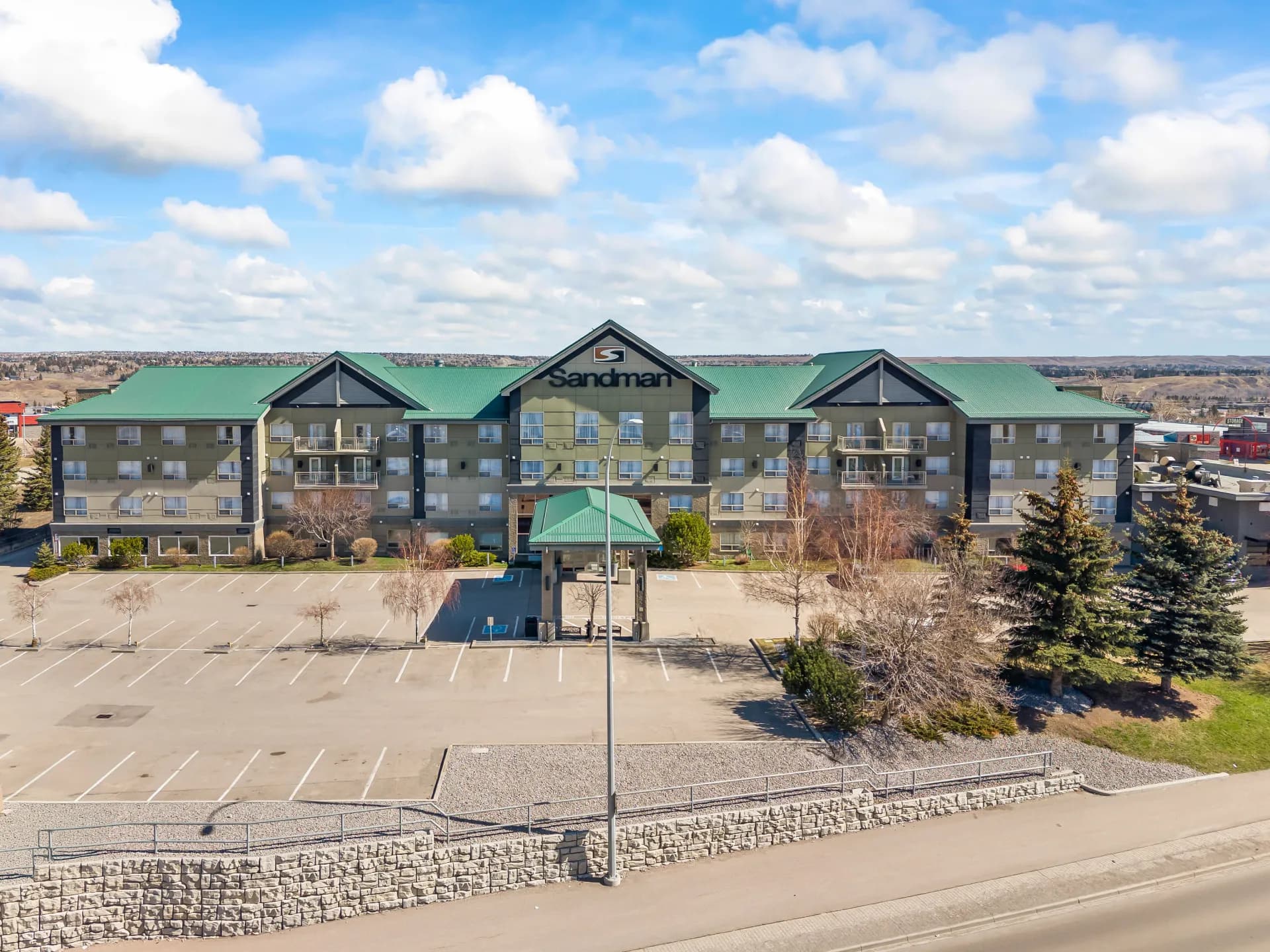 Drone photo of Sandman hotel in Calgary for hotel photography marketing by Photos 4 Real Estate