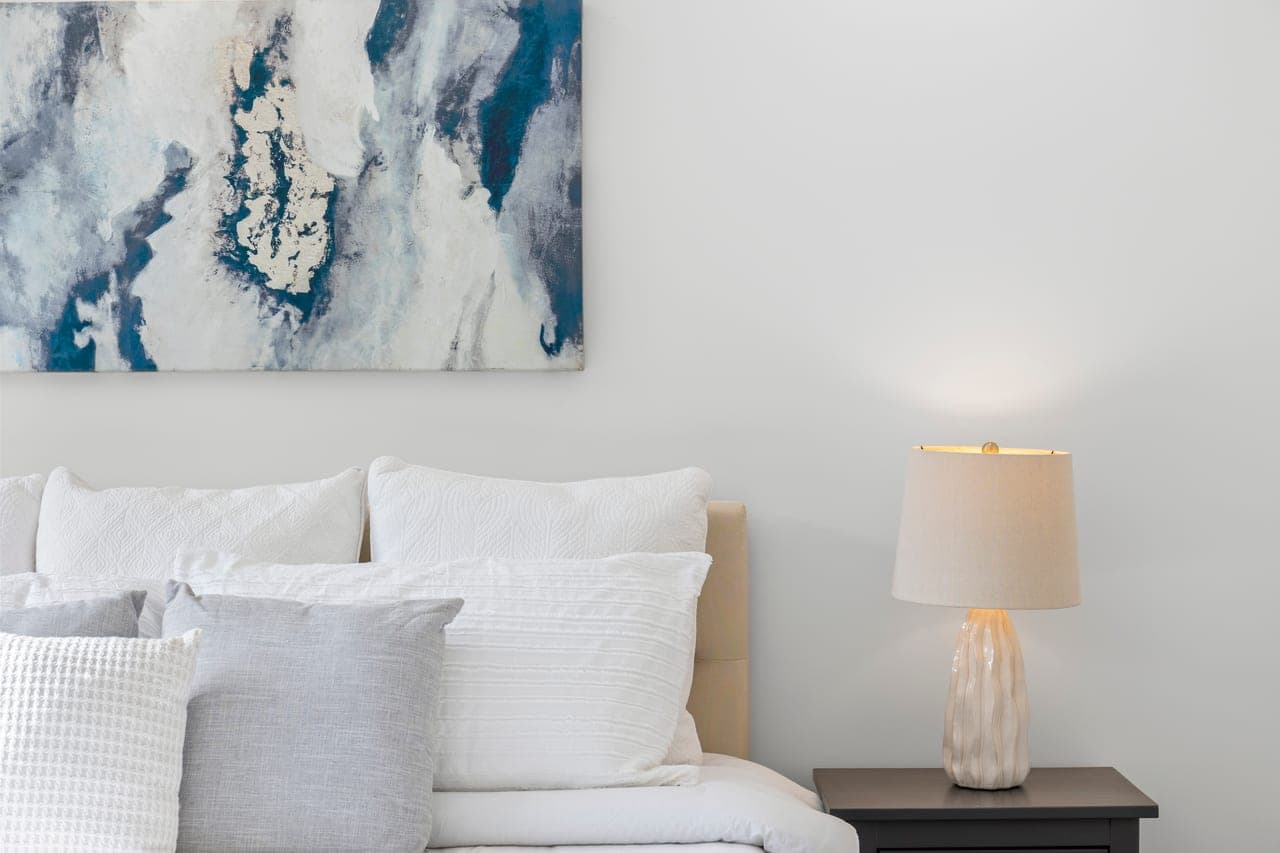 Style Shot of a bedroom bedhead with pillows and night stand
