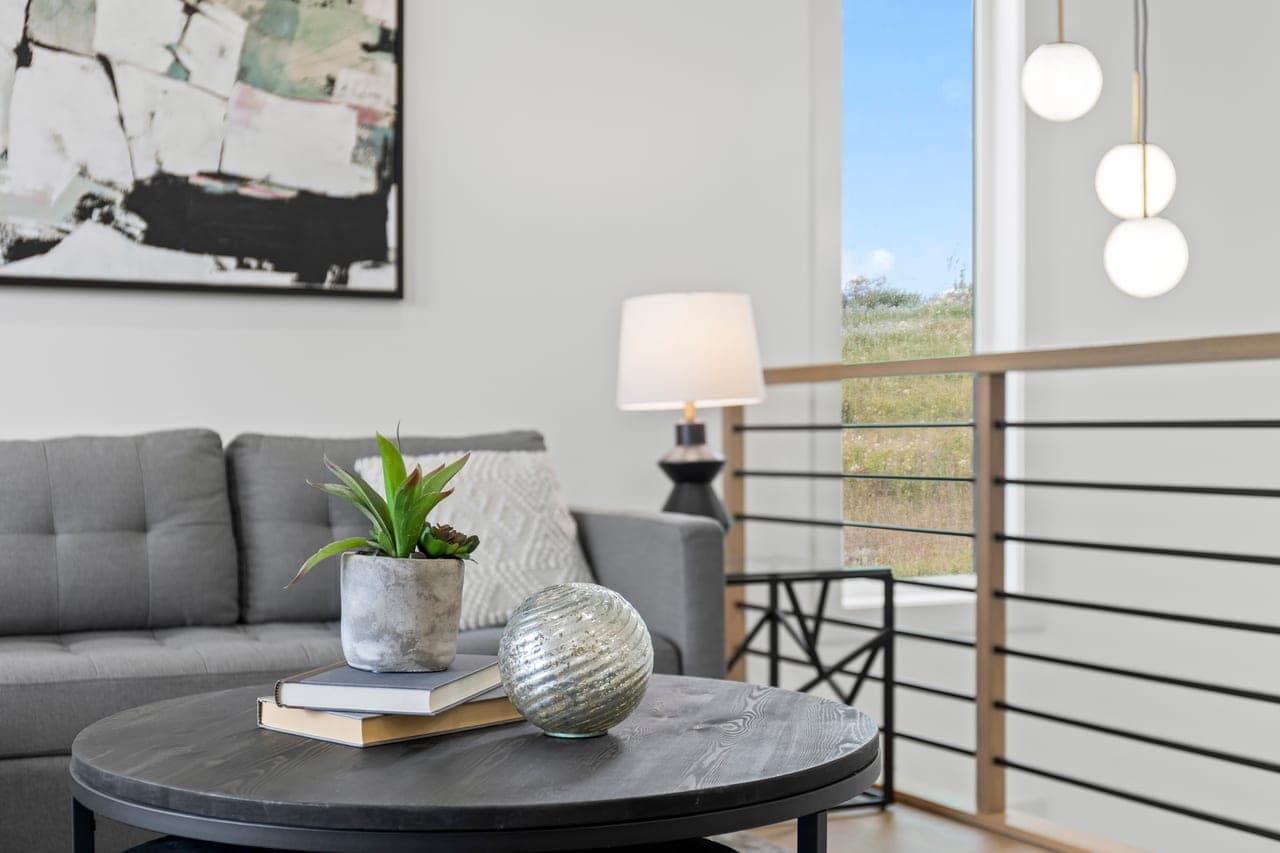 Magazine-style close-up photo of a styled coffee table for a Calgary real estate listing