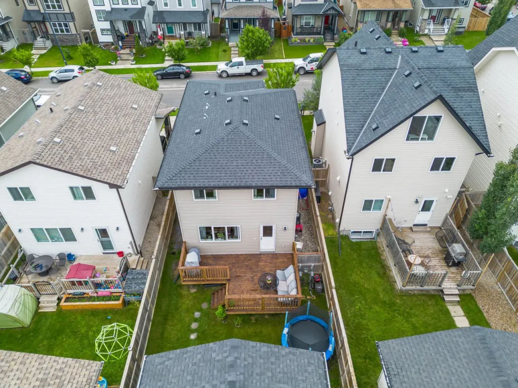 Drone view of a house's backyard - Calgary Real Estate Photos
