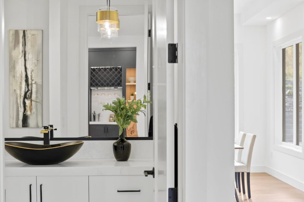 Style Shots. Washroom with black sink and décor